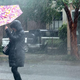 A pedestrian navigates a driving rain from Hurricane Ian on September 30, 2022 in Charleston, South Carolina.